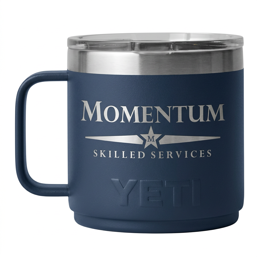 Momentum logo in silver engraving on a navy Yeti mug